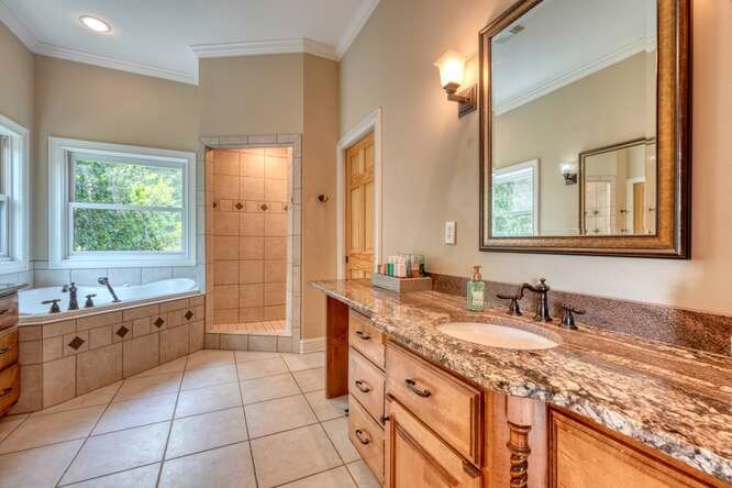 115 Dawsons Lane Murphy, NC 28906 - Photo 23 of 93 a bathroom with a granite countertop double vanity sink a mirror and a bathtub