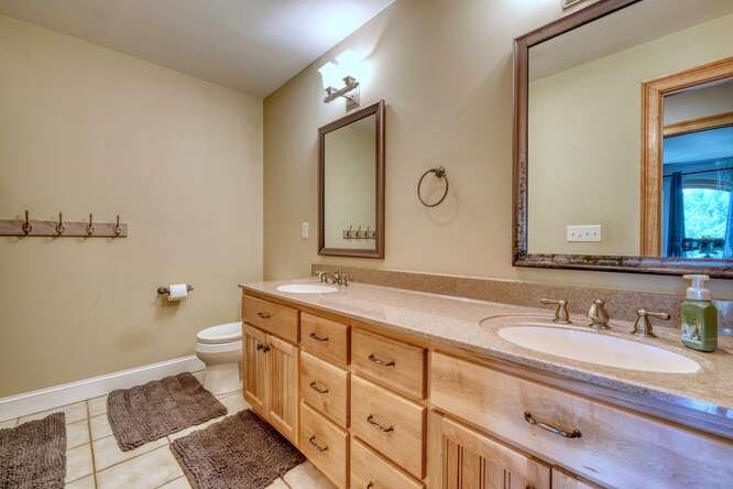 115 Dawsons Lane Murphy, NC 28906 - Photo 39 of 93 a bathroom with double vanity sink a mirror and a toilet