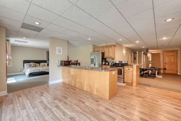 a view of house with a swimming pool and sitting area