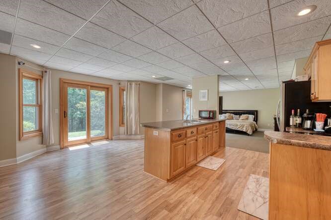 115 Dawsons Lane Murphy, NC 28906 - Photo 41 of 93 a large kitchen with stainless steel appliances granite countertop a stove a sink dishwasher a microwave oven and a dining table with wooden floor
