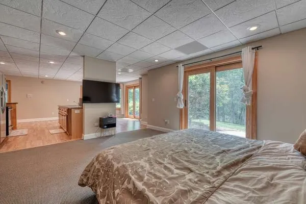 an aerial view of a house with a garden and trees