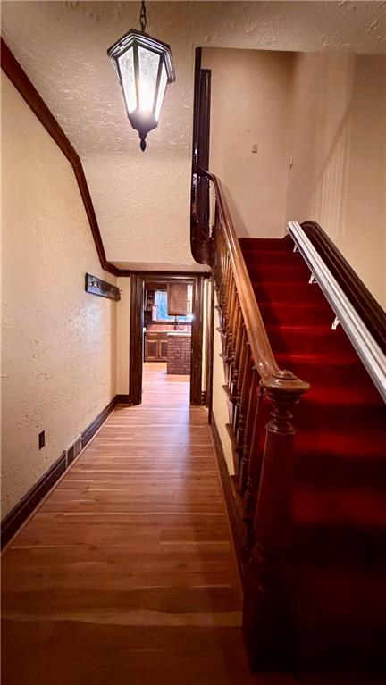 1425 Freeport Road Cheswick, PA 15024 - Photo 25 of 45 ALTERNATE VIEW OF CENTER HALLWAY SHOWING STAIRWAY TO UPPER LEVEL.