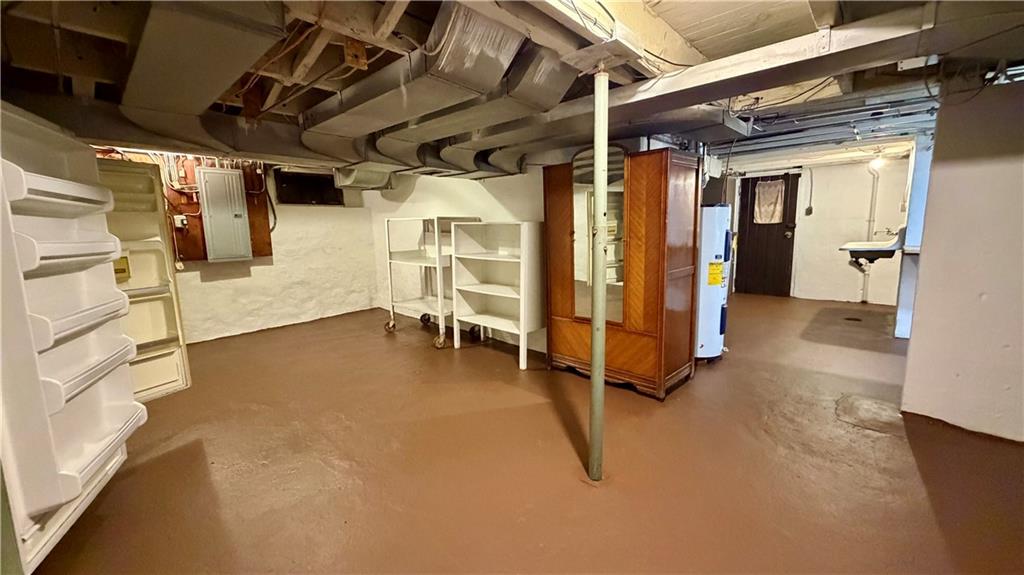 1425 Freeport Road Cheswick, PA 15024 - Photo 33 of 45 LOWER LEVEL 21X14 GAME ROOM. CURRENTLY HOUSES FREEZER, REFRIGERATOR, WOOD WARDROBE AND SHELVING THAT ALL STAYS! FRESHLY PAINTED!