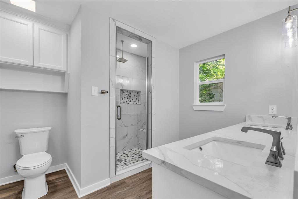 3608 North 26th Street Waco, TX 76708 - Photo 13 of 28 a bathroom with a sink toilet and shower
