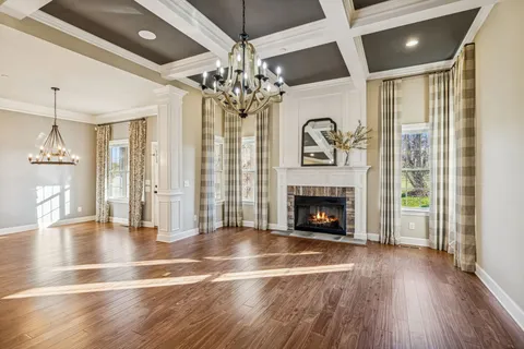 a open kitchen with stainless steel appliances granite countertop a refrigerator a sink and a wooden floors