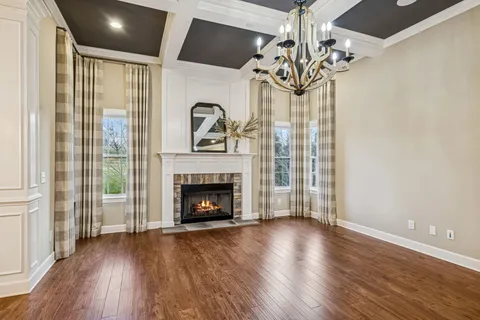 a kitchen with stainless steel appliances kitchen island granite countertop a sink cabinets and wooden floor
