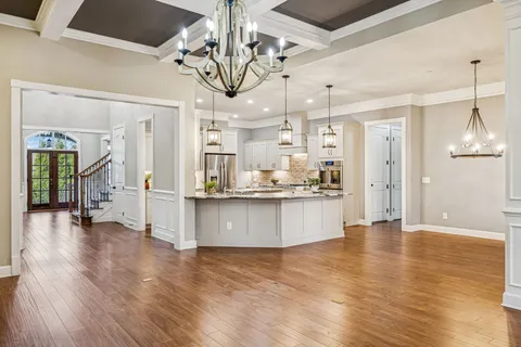 a kitchen with a sink stove and refrigerator