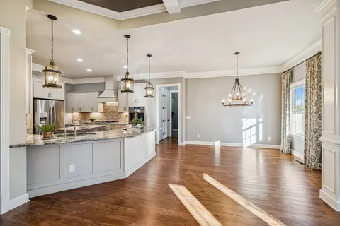 a kitchen with a sink appliances and cabinets