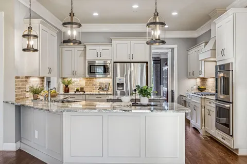 a kitchen with stainless steel appliances a cabinets and a sink