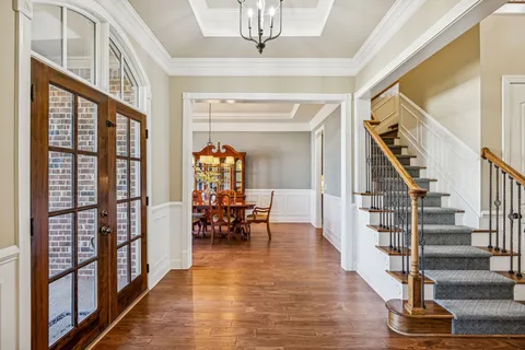 a view of front door with dining room and stairs