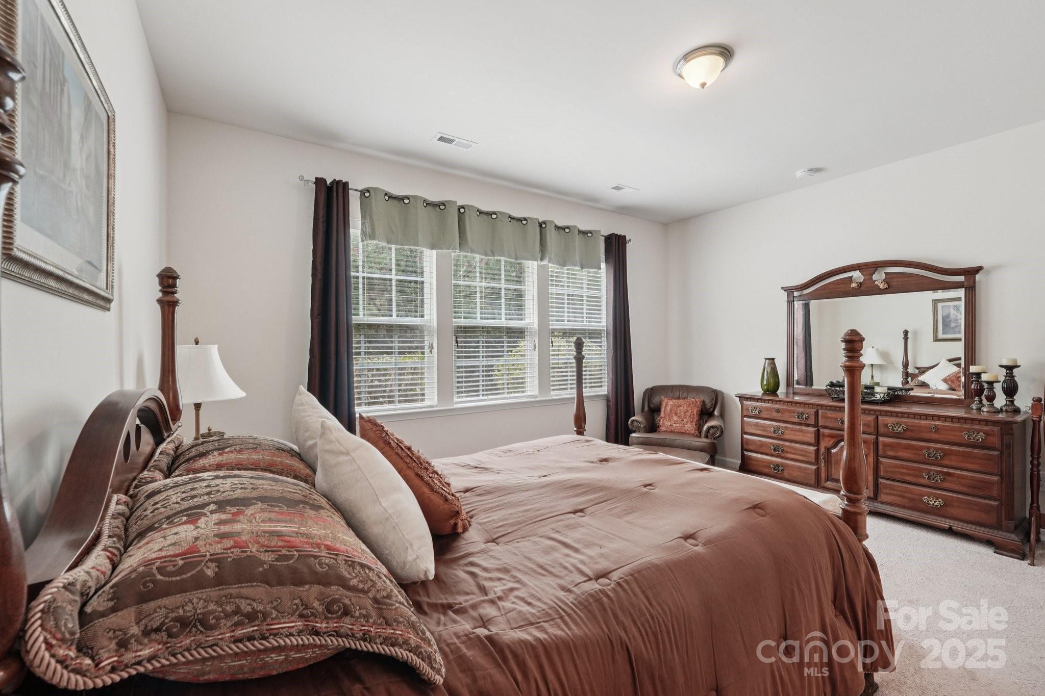 8058 Asher Chase Trail Lancaster, SC 29720 - Photo 17 of 48 a bedroom with a bed and a large window