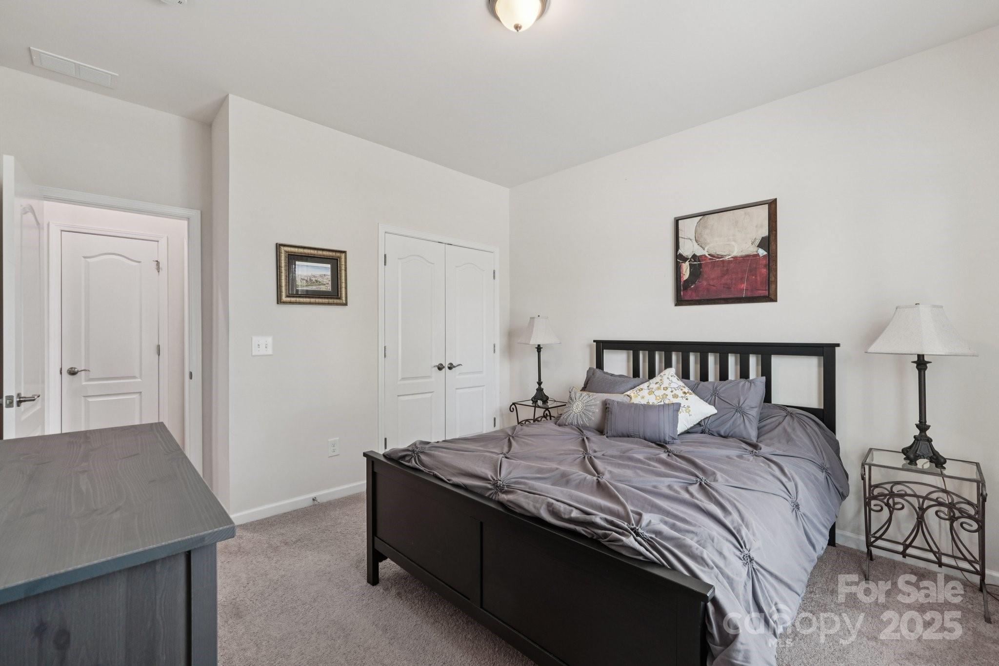 8058 Asher Chase Trail Lancaster, SC 29720 - Photo 25 of 48 a large bed sitting in a bedroom and a table