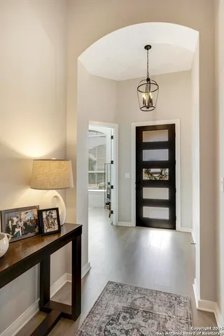 a view of a hallway with a white stove