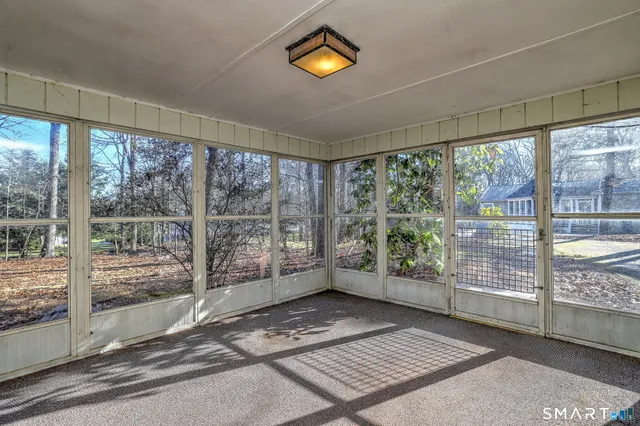 a view of a bathroom from a hallway