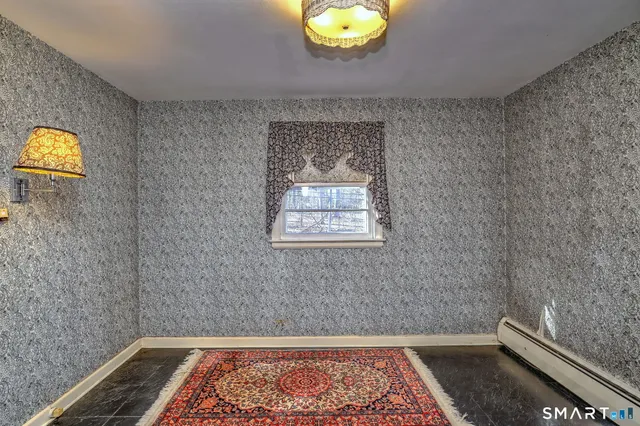 a bathroom with a sink toilet and mirror