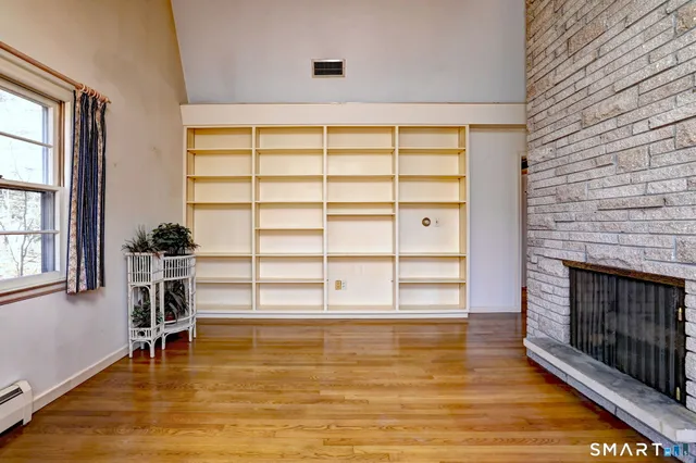 a living room with a rug and a rug