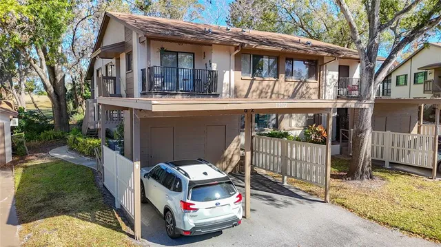 a view of a dining room with furniture and a large window