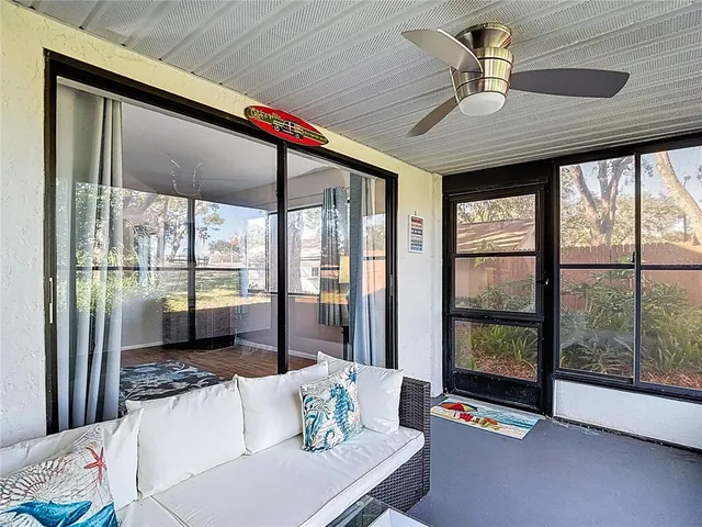 a bedroom with a bed and a potted plant