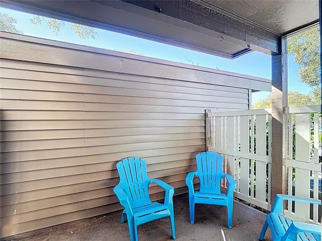a view of swimming pool with outdoor seating