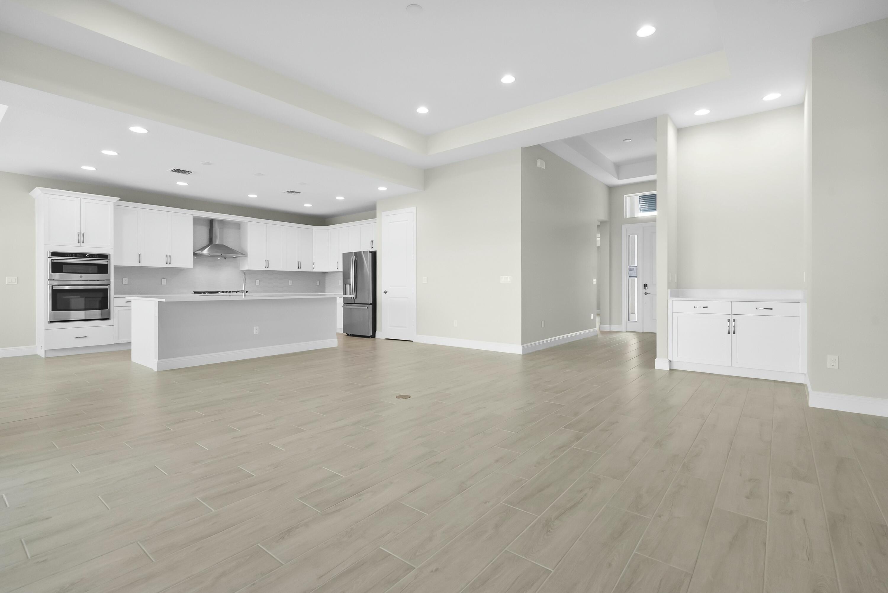 6382 High Pointe Circle Vero Beach, FL 32967 - Photo 14 of 55 an empty room with kitchen appliances and cabinets