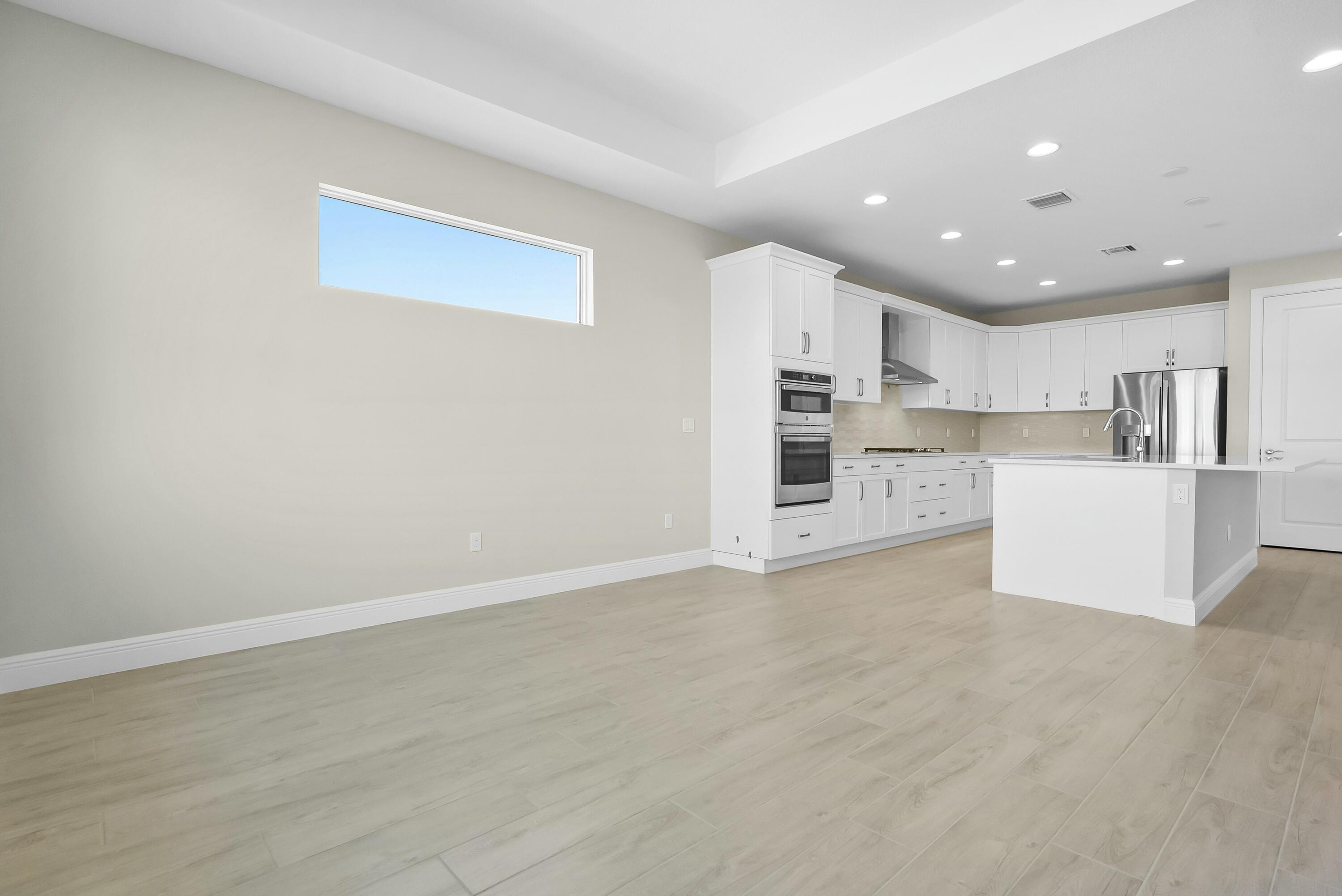6382 High Pointe Circle Vero Beach, FL 32967 - Photo 28 of 55 a view of a kitchen with wooden floor