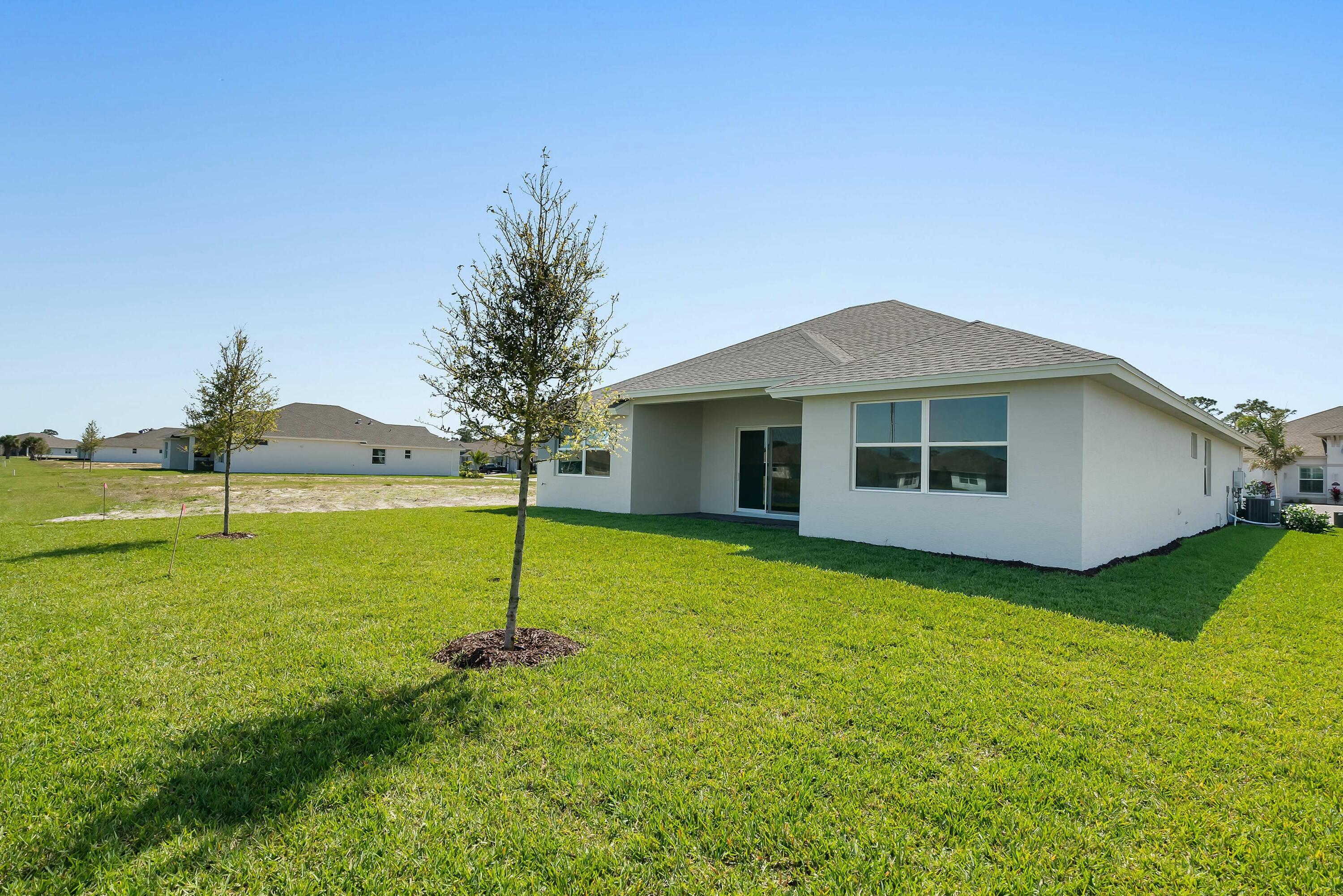 6382 High Pointe Circle Vero Beach, FL 32967 - Photo 53 of 55 a house with garden in front of it
