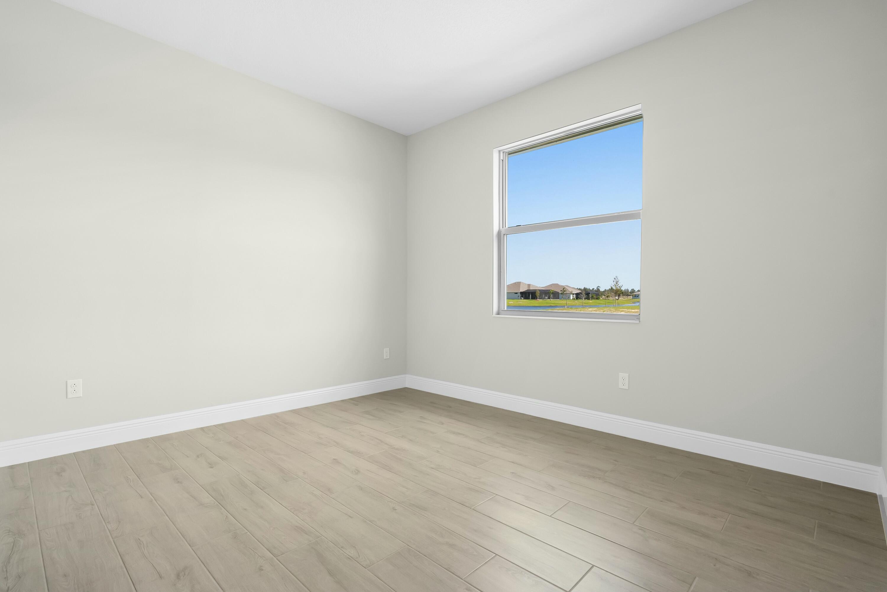 6382 High Pointe Circle Vero Beach, FL 32967 - Photo 7 of 55 an empty room with a bench