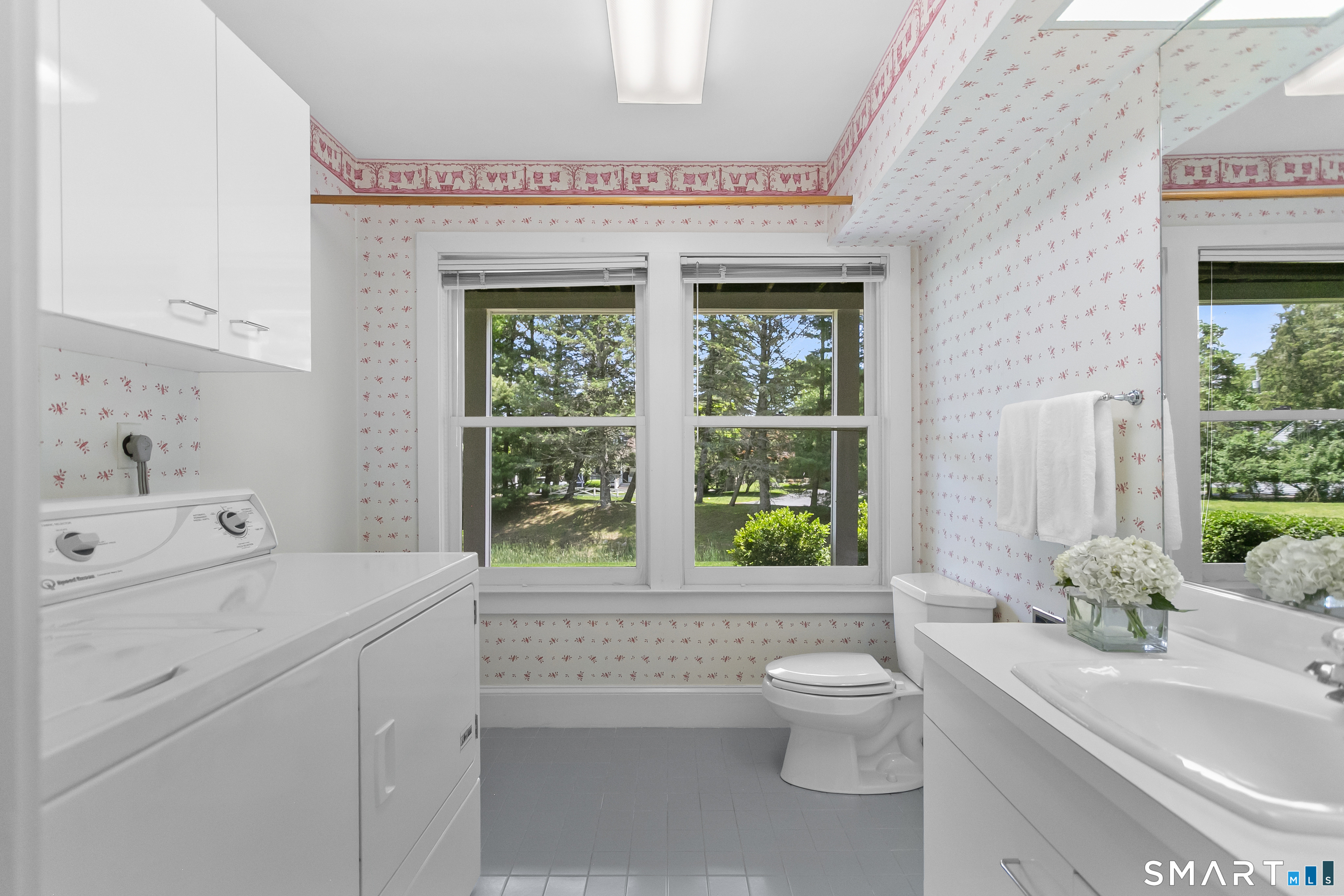 936 South Pine Creek Road Fairfield, CT 06824 - Photo 28 of 39 Laundry room and half bath off of office.