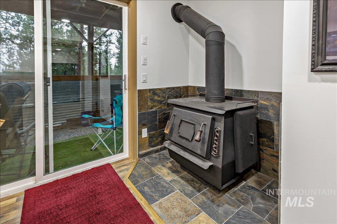 79 Sunset Loop Cascade, ID 83611 - Photo 29 of 44 Built-in wood stove with slate tile hearth and partial wall surround