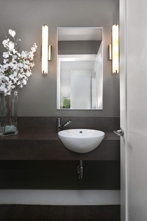 9 Avondale Road Newton, MA 02459 - Photo 11 of 23 a bathroom with a sink and a mirror