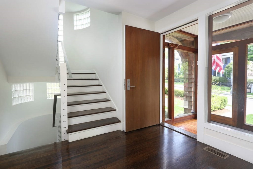 9 Avondale Road Newton, MA 02459 - Photo 13 of 23 a view of a hallway with wooden floor and windows