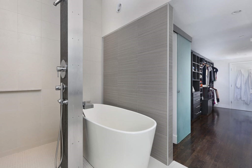 9 Avondale Road Newton, MA 02459 - Photo 16 of 23 a white bath tub sitting in a bathroom