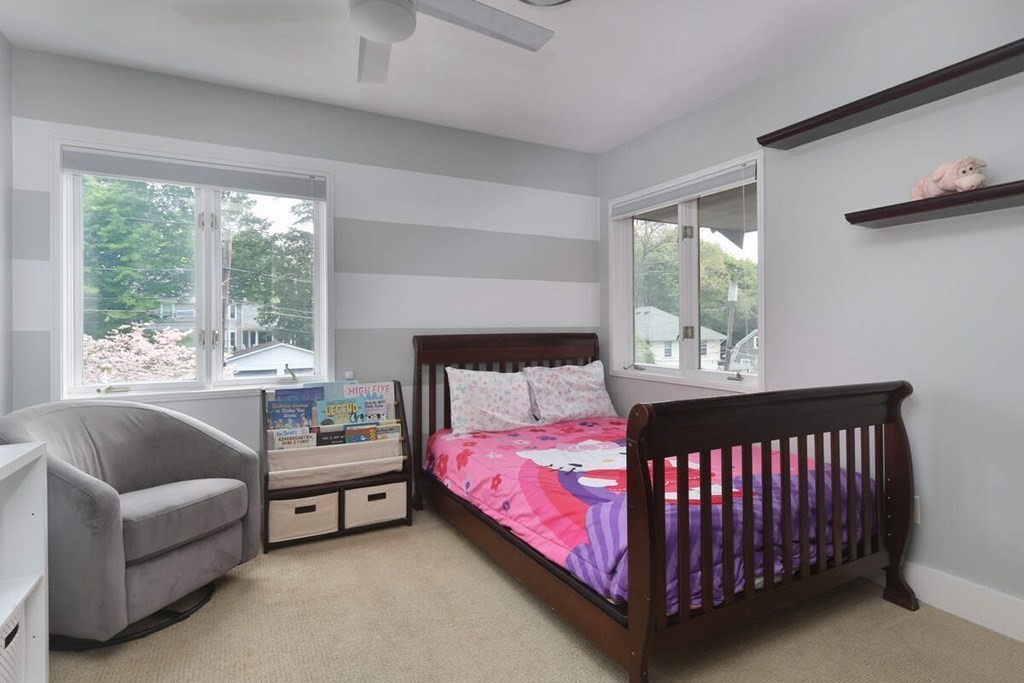 9 Avondale Road Newton, MA 02459 - Photo 18 of 23 a bed sitting in a bedroom next to a window