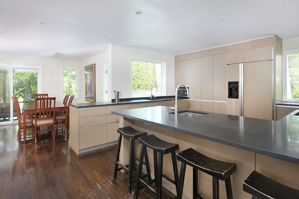 9 Avondale Road Newton, MA 02459 - Photo 3 of 23 a kitchen with a table chairs sink and cabinets