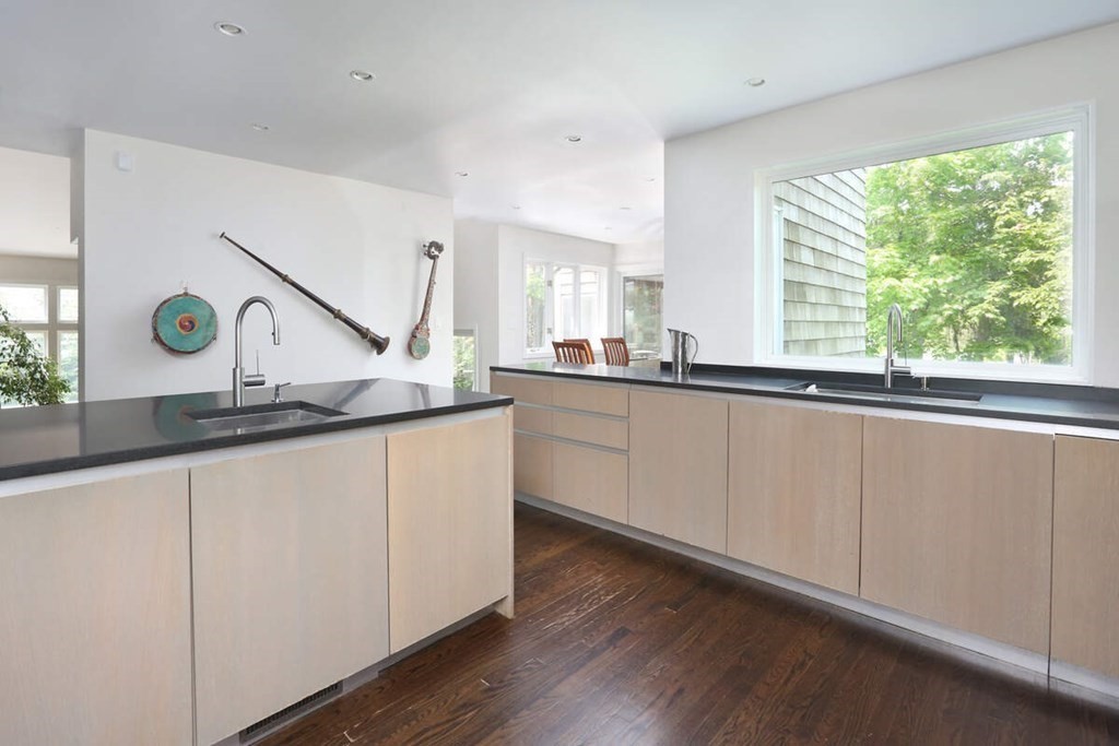 9 Avondale Road Newton, MA 02459 - Photo 4 of 23 a kitchen with granite countertop a sink and a window