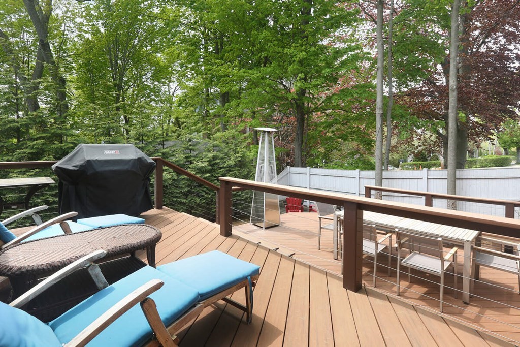 9 Avondale Road Newton, MA 02459 - Photo 9 of 23 a view of a patio with lawn chairs next to a yard