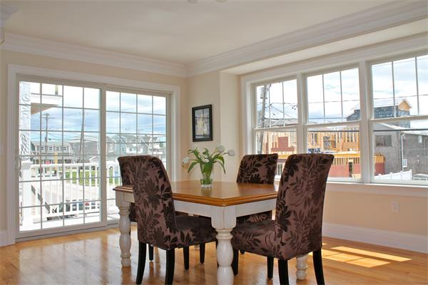 153 Jericho Road, Unit 1 Scituate, MA 02066 - Photo 1 of 26 a view of a dining room with furniture window and outside view