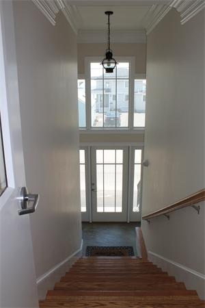 153 Jericho Road, Unit 1 Scituate, MA 02066 - Photo 26 of 26 a view of an empty room with wooden floor and a window