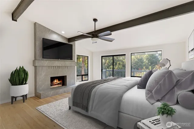 a spacious bedroom with a bed and a fireplace