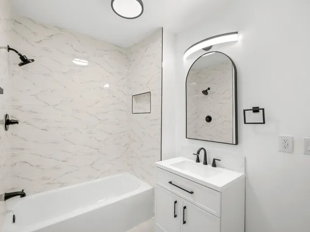 a bathroom with a sink a toilet and a bathtub