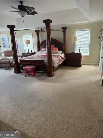 a bedroom with bed and window