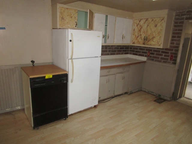 4405 Greenwood Road Woodstock, IL 60098 - Photo 2 of 10 a white refrigerator freezer sitting in a kitchen