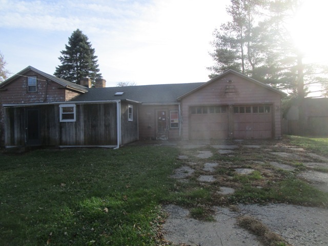 4405 Greenwood Road Woodstock, IL 60098 - Photo 9 of 10 a view of a yard in front of a house with large trees