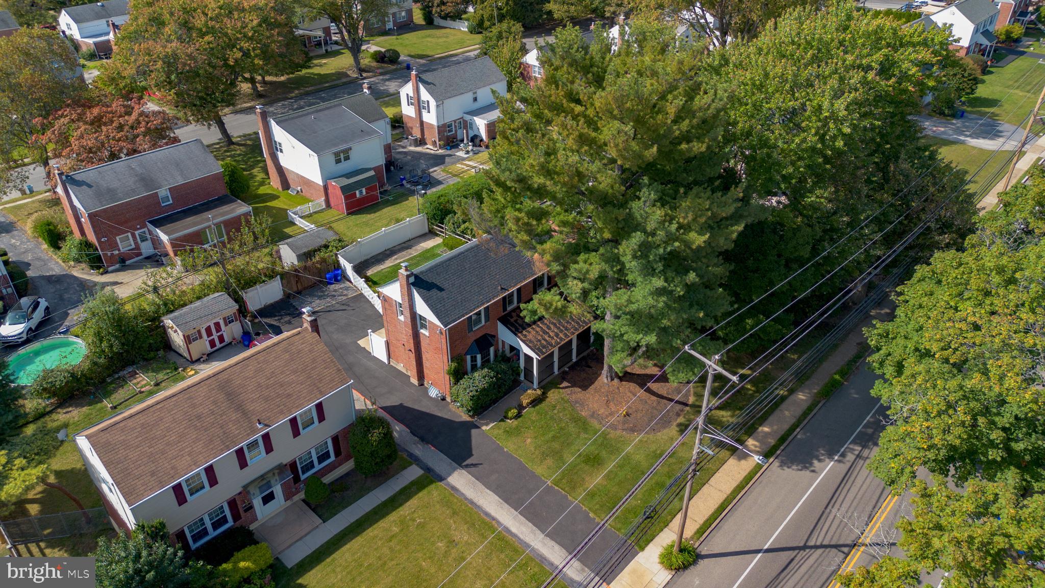 304 Earlington Road Havertown, PA 19083 - Photo 25 of 26 an aerial view of a house with swimming pool outdoor seating and yard