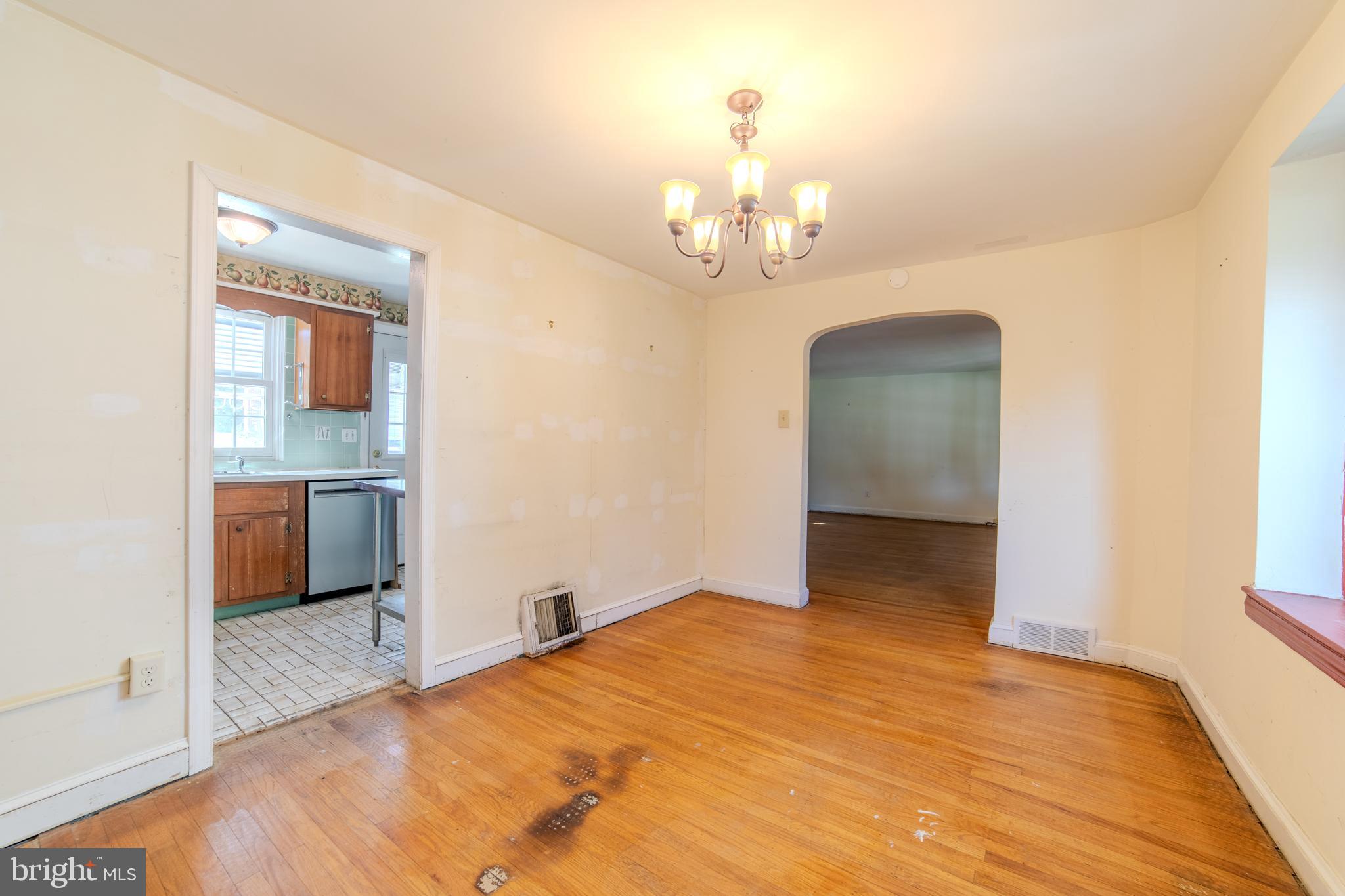 304 Earlington Road Havertown, PA 19083 - Photo 6 of 26 a bedroom with a bed and a chandelier