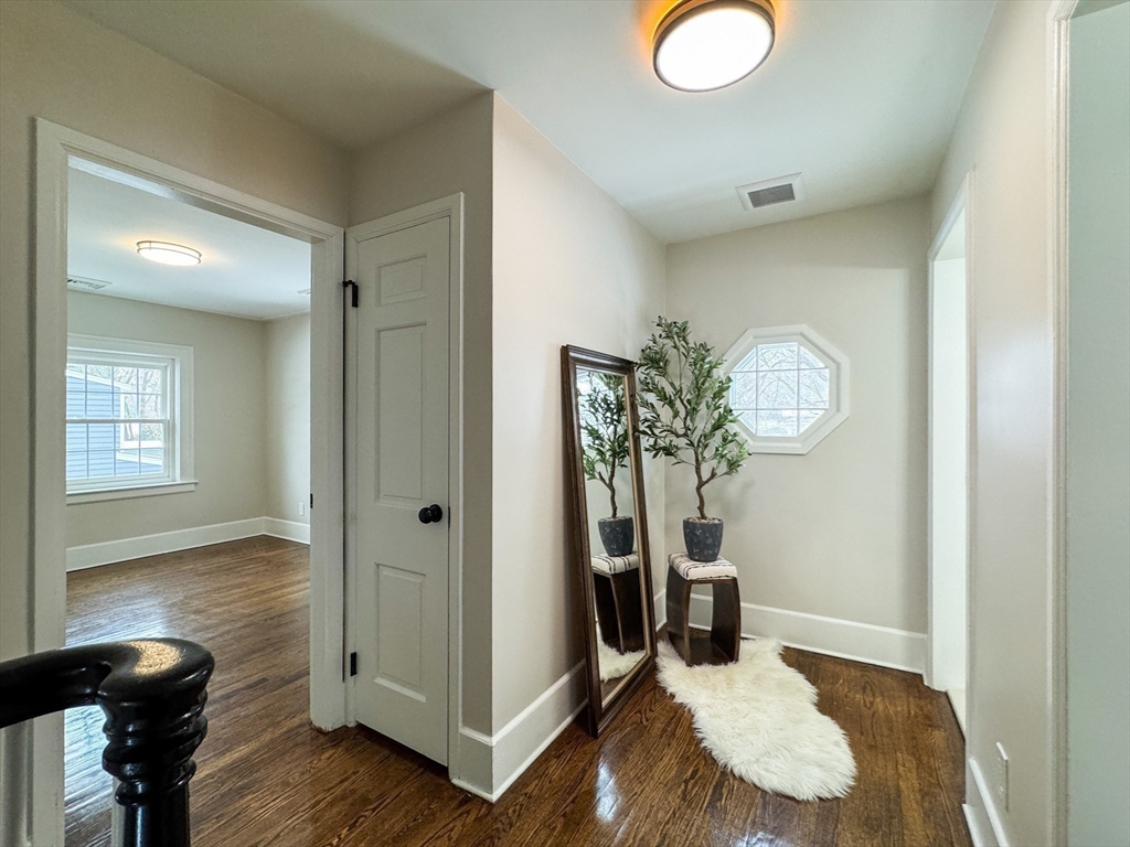 51 Westfield Road Warwick, RI 02888 - Photo 20 of 31 a bedroom with a bed and wooden floor