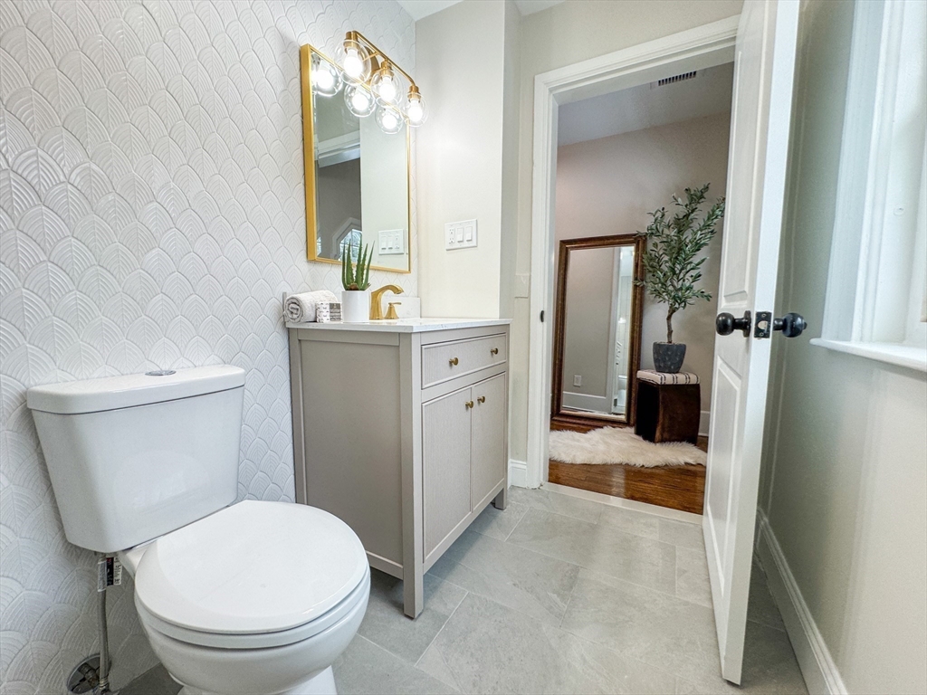 51 Westfield Road Warwick, RI 02888 - Photo 24 of 31 a bathroom with a sink a toilet and shower
