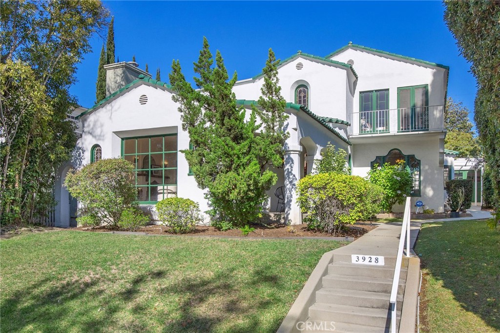 a front view of house with garden