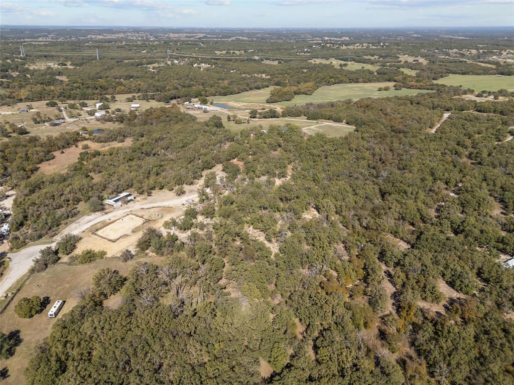 262 North Cheyenne Springtown, TX 76082 - Photo 35 of 35 Aerial overview of property's location featuring a heavily wooded area