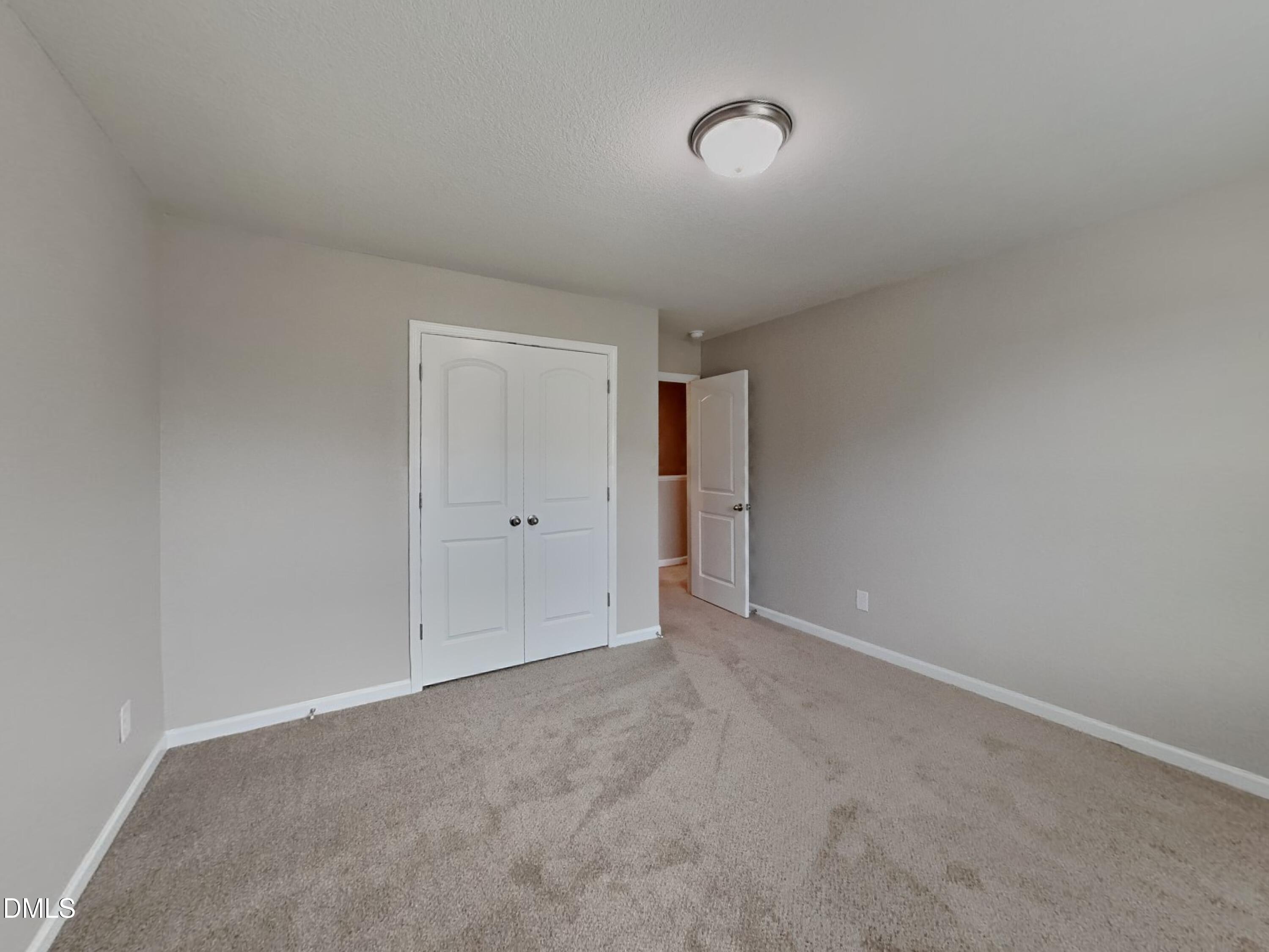 784 Frosty Way Zebulon, NC 27597 - Photo 9 of 15 a view of an empty room and a window